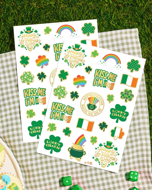 hand-drawn designs: shamrocks, pot of gold, four leaf clovers, leprechauns, and 'kiss me i'm irish'