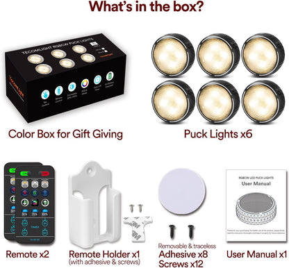 compact 2.95" round puck in powder-coated black or white, available in 2-pack and 6-pack configurations; includes wall-mountable remote control holder
