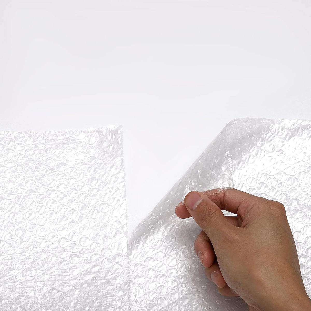 flat outer side optimized for clean application of packing tape and shipping labels