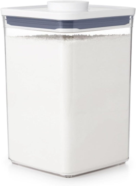 push-button lid that creates an airtight seal and doubles as an opening handle