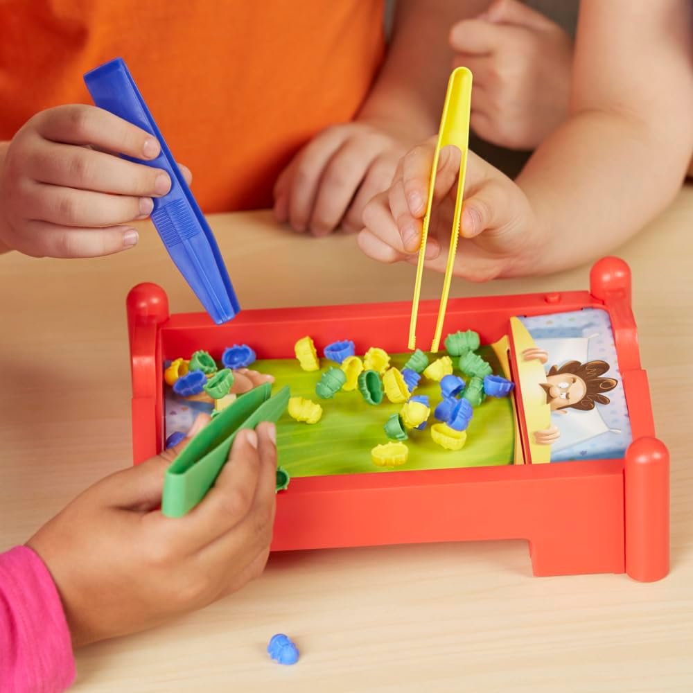 three color-coded tongs (blue, yellow, green) for color-matching bug catching