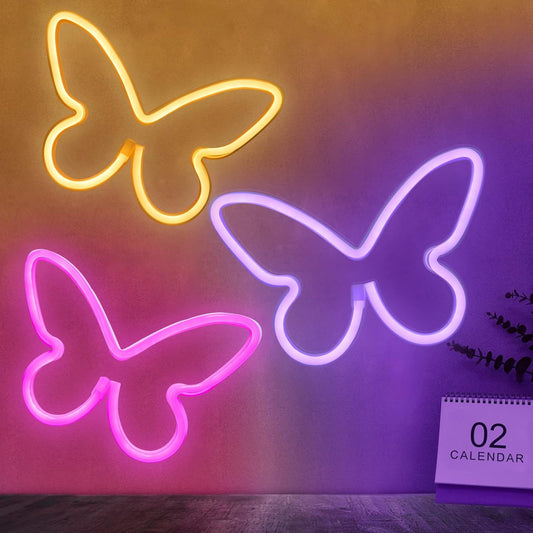 three-piece butterfly neon sign set in pink, purple, and warm white